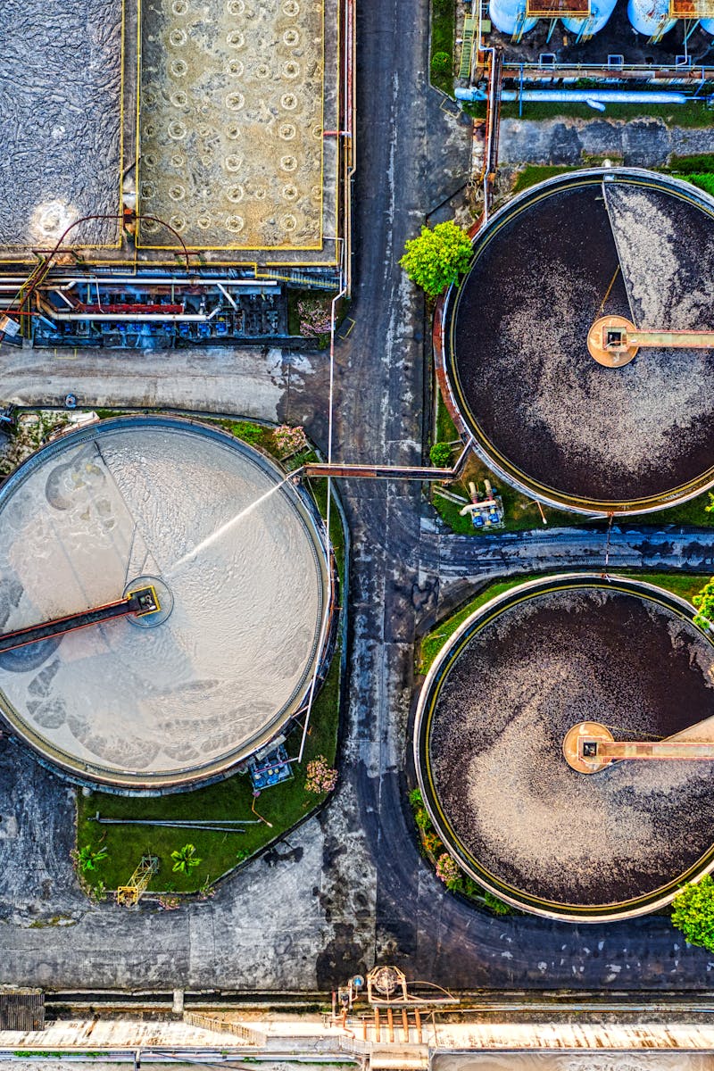 Top-down view of a water treatment plant in an industrial area of Indonesia.